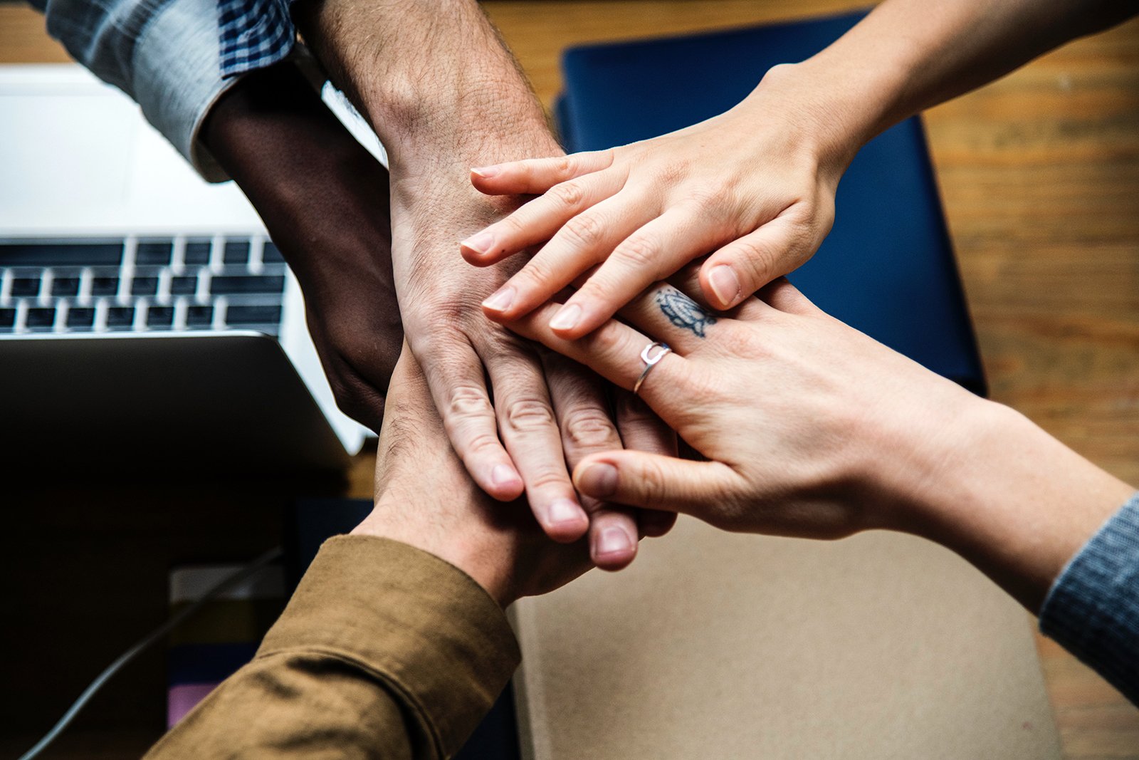 Hands joined together in support